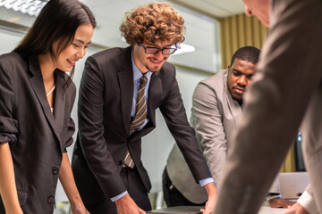 Group of business meeting and discussing strategy with startup project analysis finance process.Success business people plan and brainstorm marketing idea with document in office.Teamwork