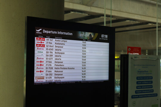 Flight information display system showing airline schedule. Yogyakarta International Airport YIA is a modern facility serving international and domestic flights. Kulon Progo - Indonesia 09 03 2023