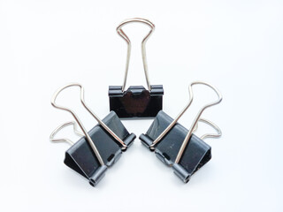 Three Binder Clips With Various Handle Position Isolated On White Background