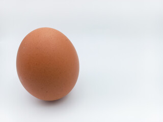 Brown Chicken Egg Standing Position Isolated On White Background With Negative Space