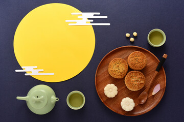 Background of Chinese Traditional Festival Mid-Autumn Festival.The Chinese meaning on the mooncake in the picture is: high-quality five kernels, milk flavored grapes, chestnuts, three flavors.
