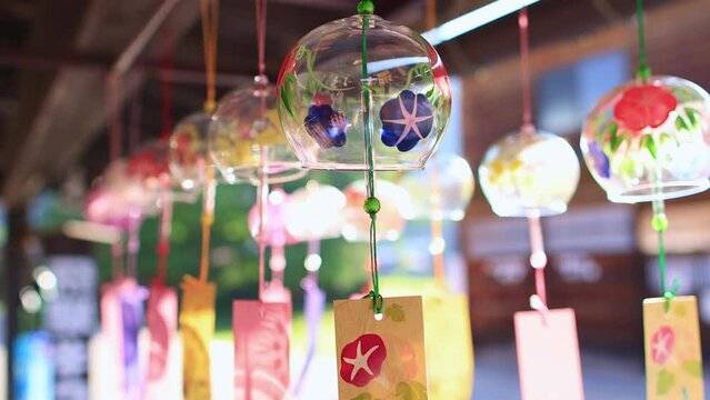 Wind chimes swaying in the wind. Symbolic decoration of Japanese summer. Traditional Japanese glass bells, zen meditation