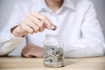 man with piggy bank The concept of bank account savings and investments to maximize profits.	
