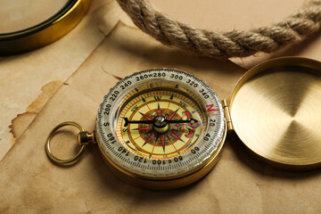 Fototapeta na wymiar Sea travel concept. Vintage compass on the table