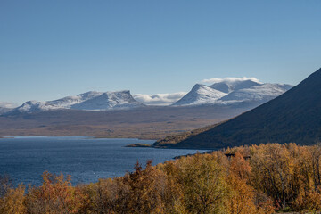 Autumn season in Abisko with Lake Tornetraesk in background, taken from Bjoerkliden, Swedish Lapland, Sweden