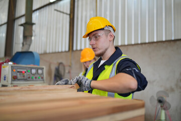 Industrial factory employee working in wooden manufacturing industry