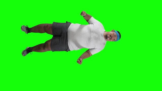 4k footage of overweight Asian man dancing isolated on Green Screen 