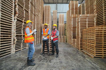 Worker in a timber and lumber warehouse. Product acceptance and quality control. worker doing warehouse inventory check.