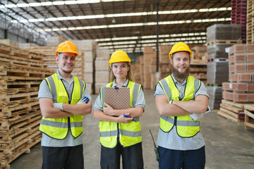 Warehouse worker working at lumber yard in Large Warehouse. Worker are  Inventory check at Storage shelves in lumberyard.