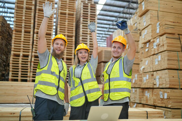 Warehouse worker working at lumber yard in Large Warehouse. Worker are  Inventory check at Storage shelves in lumberyard.