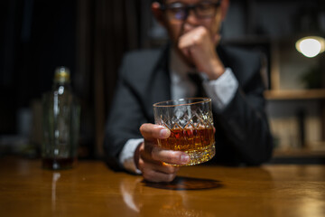 Obraz na płótnie Canvas Businessmen in suits drinking whiskey