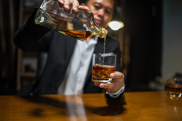 Businessmen in suits drinking whiskey