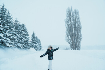 Woman tourist Visiting in Biei, Traveler in Sweater sightseeing Tree of Ken and Marry with Snow in...