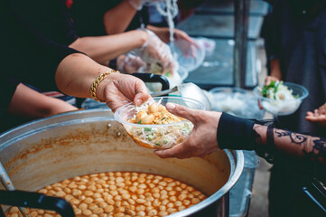 Giving free food to the poor in the community: the idea of helping without expectation of return.
