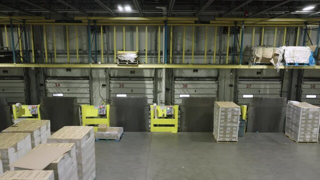 Aerial View of Empty Warehouse Loading Dock with Closed Doors, Pandemic Impact on Logistics