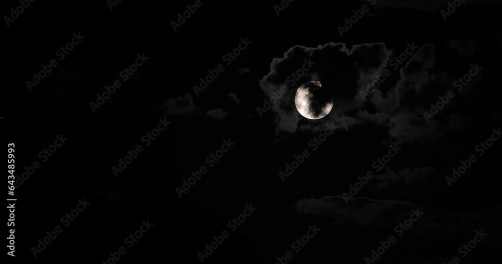 Wall mural super moon behind clouds at night