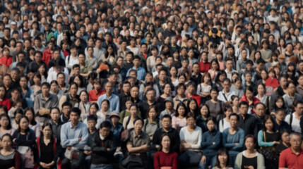 A lot of Asian people on the street of a big city, blurry photo. Background to illustrate the demographic crisis and overpopulation on the planet Earth. - obrazy, fototapety, plakaty