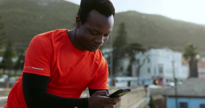 African man, phone and thinking with fitness, app or outdoor for reading, smile or laugh at comic meme on rooftop. Guy, smartphone and happy for contact, ideas and social media with training in metro