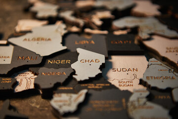 Niger, Chad and Sudan on wooden map of African continent - obrazy, fototapety, plakaty