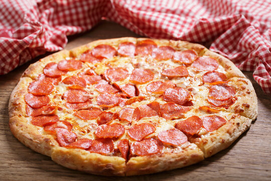 pizza pepperoni on wooden table