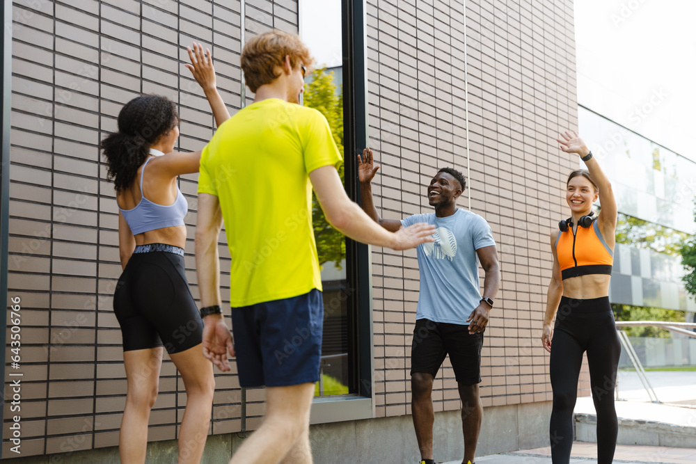 Canvas Prints group of athletic people greeting each other before workout at street