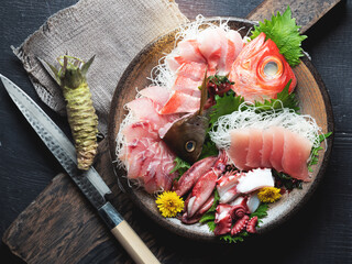 A variety of sashimi and seafood on one plate