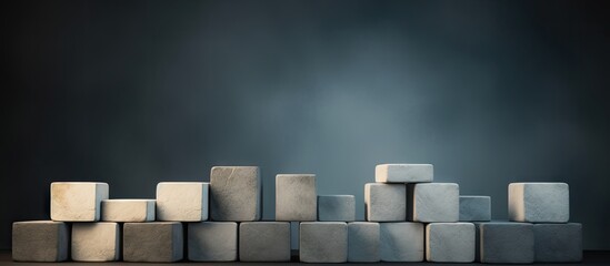 Minimal presentation with gray stone blocks arranged on a dark brown background Ideal for branding with empty space to showcase your product