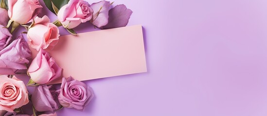 Mockup of a romantic scene with flowers and a blank card on a purple background Suitable for Valentines Spring or Mothers day