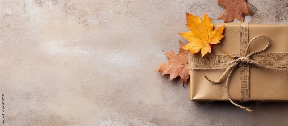 Poster Autumn themed composition with wrapped gift rustic background Fall concept flat lay copy space