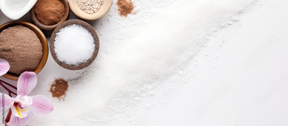 Poster top view of white background with coffee scented spa salt oil loofah and soap representing the conce