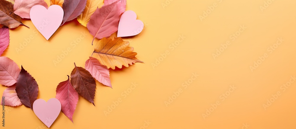 Aufkleber pink studio shoot with heart shaped cutout surrounded by autumn leaves in orange green yellow and br
