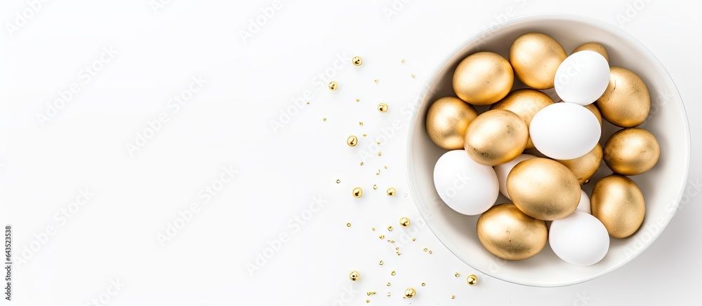 Aufkleber white eggs adorned with gold foil in bowl background is white overhead view easter theme