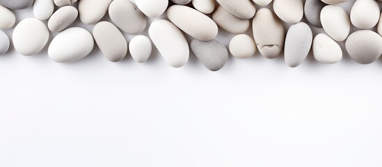 White pebbles on white surface with room for text