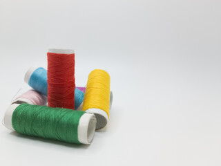 Coils of color threads on a white isolated background