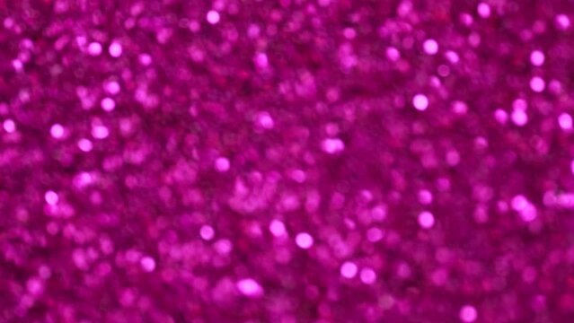 Abstract bright pink background, motion blurred purple lights, bokeh effect. Futuristic magenta glittering in space.