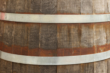 Traditional wooden barrel as background, closeup. Wine making