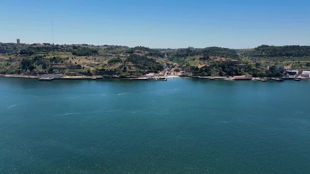 Drone shot from crossing over the river Tejo with a drone. Bel&eacute;m to Porto Brandao.