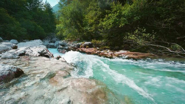 Soča mountain river in Triglav National Park Slovenia, Slovenian alps Isonzo. Blue turquoise water rushing through a naturally formed canyon, waterfall cascade and rocks. Cinemagraph seamless video 4K