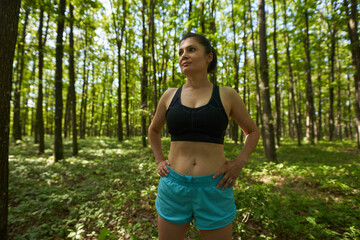 Woman running through forest
