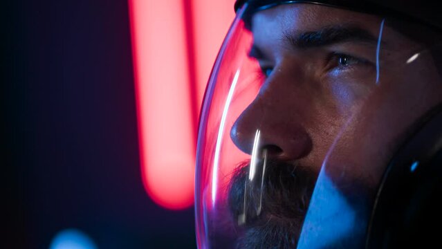 Portrait of futuristic astronaut.  conception. Augmented reality game, future technology, astronomy, AI concept. Neon blue and red light. Dark background.