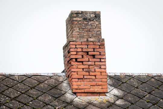 Old brick chimney, heating season. Repair and renovation