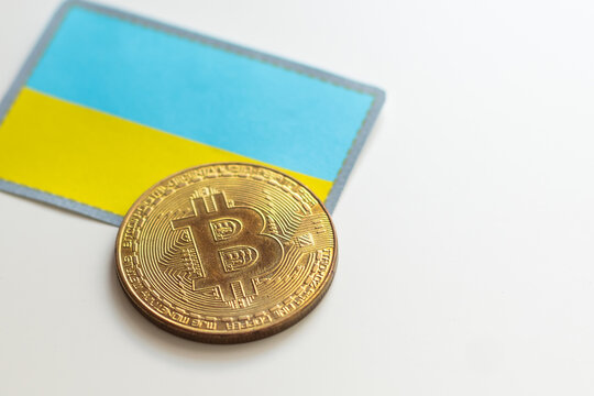 Bitcoin symbol on Ukrainian flag 3D background. Crypto-currency background for virtual money and store of value. Concept of political regulation in Cryptocurrencies in Ukraine.