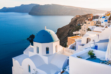 White architecture in Santorini island, Greece. Church with blue dome n Oia town.