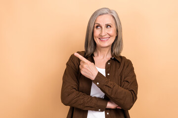 Portrait of satisfied friendly person wear stylish jacket indicating look at empty space service...