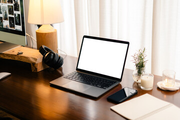 Fototapeta na wymiar Laptop with blank screen on wooden table