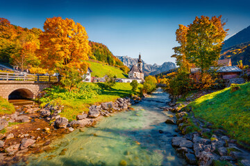 Spectacular morning scene of Parish Church of St. Sebastian. Colorful autumn view of Ramsau village, Bavaria, Germany, Europe. Beauty of countryside concept background..