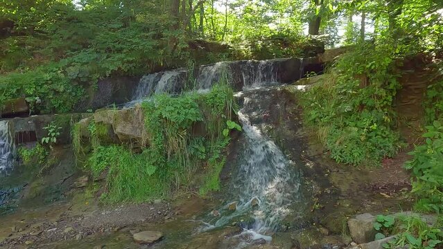 Beautiful summer scene of Pid Skelyamy waterfall. Splendid morning view of Sukel' River. Splendid morning view of Carpathian mounatains, Ukraine, Europe. 4K video (Ultra High Definition).