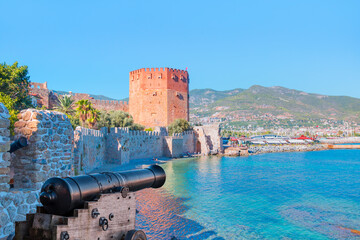 The famous red tower (Kizil Kule) with black cannon - The symbol of the resort town of Alanya - Alanya, Turkey