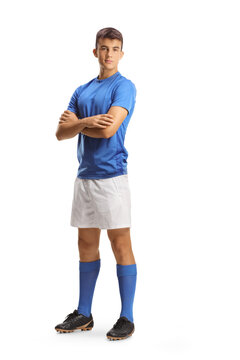 Full length portrait of a young football player in a blue jersey posing with folded arms
