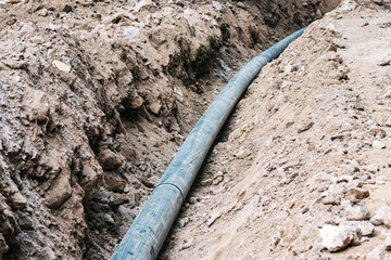 construction, where plastic pipes and tubes create an underground network for water supply, a...